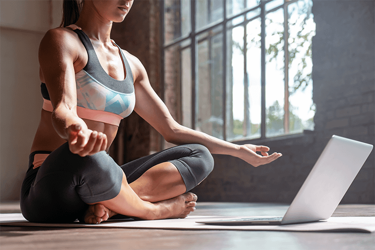 Yoga teacher doing online class